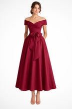 Model in dress captured from rear angle