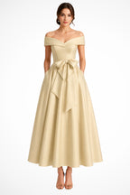 Close-up of statement bow detail at waist