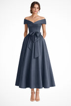 Model posing in dress showing full length midi hem