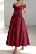 Side profile showing dress silhouette and skirt flow