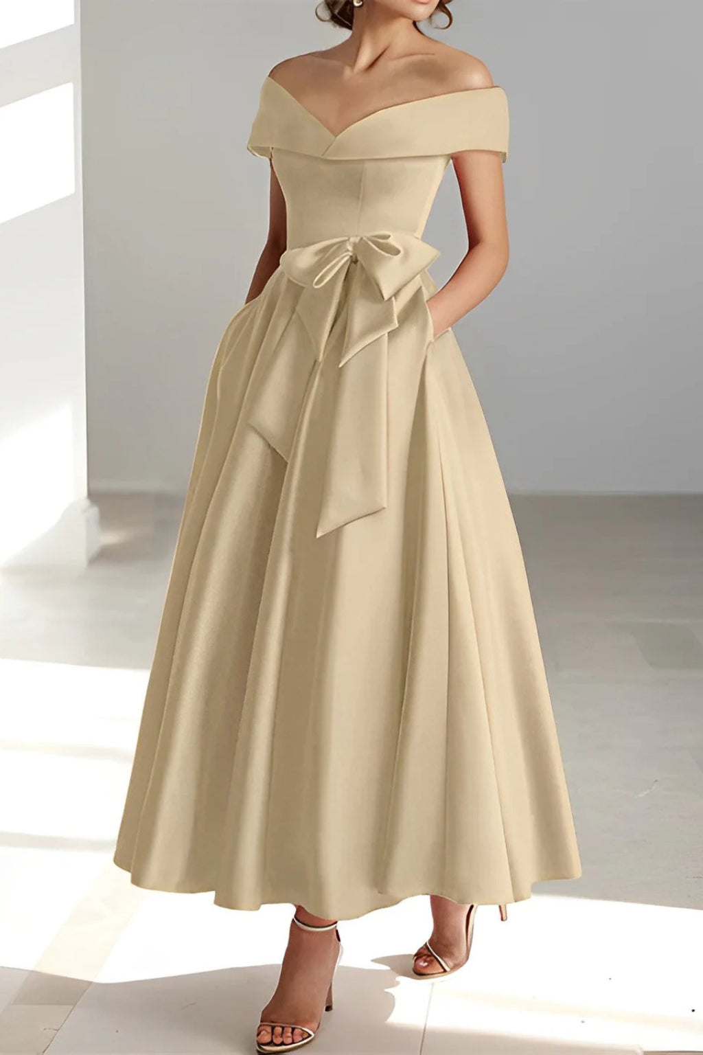 Back view of off shoulder neckline and bow accent