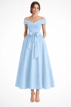 Off shoulder bow waist midi dress worn on model, front view