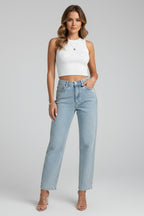 Model wearing high waist shimmer jeans with neutral top, front view