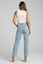 Detail shot of back pocket and waistband on shimmer jeans