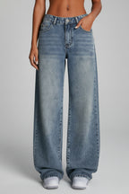 Light blue wide leg jeans styled with fitted knit top, side profile
