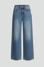 Woman wearing light blue wide leg denim jeans, front view