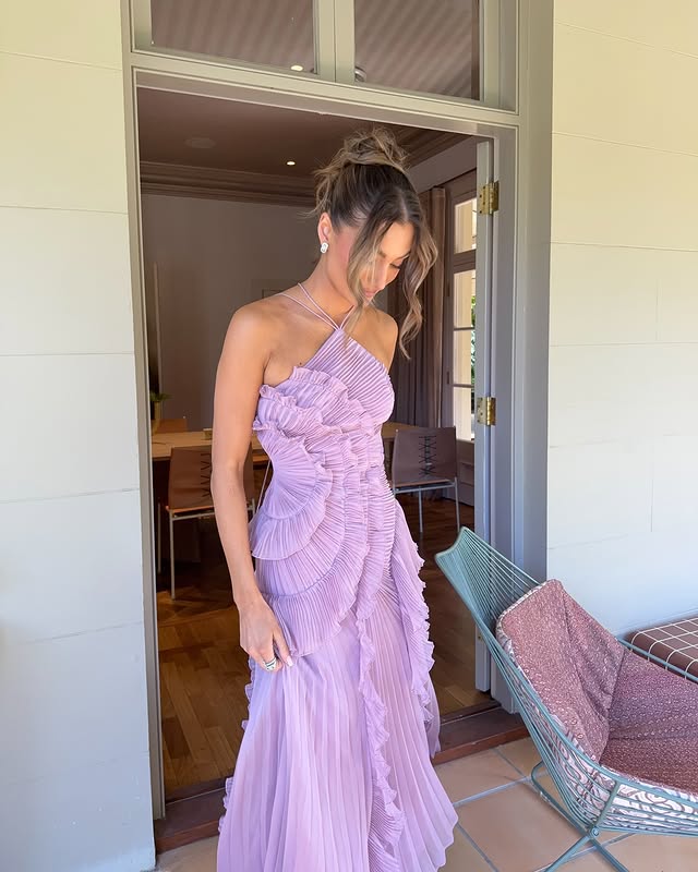 Close-up of pleated ruffle detailing and cascading layers on dress