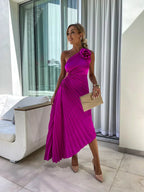 Model wearing dress at three-quarter angle, movement pose