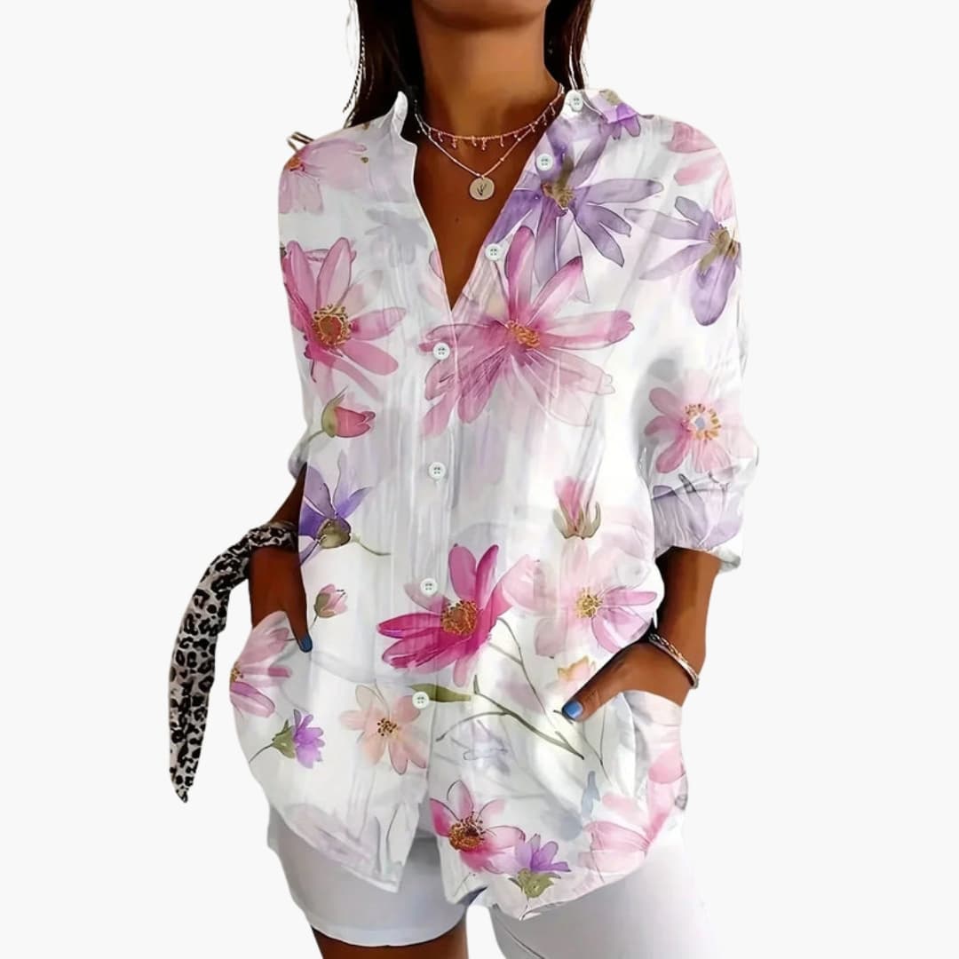 Model wearing abstract blouse, side profile showing relaxed fit and sleeve length