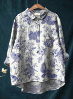 Seated pose showing floral shirt fit and drape