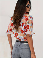 Close-up detail of multicolour floral pattern and button-down front