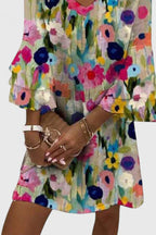 Model wearing floral midi dress in standing pose showing full length silhouette