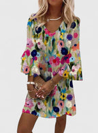 Women's multicolour floral midi dress with V-neckline displayed on flat background