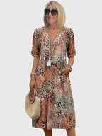 Women's floral midi dress with V-neckline, front view on model