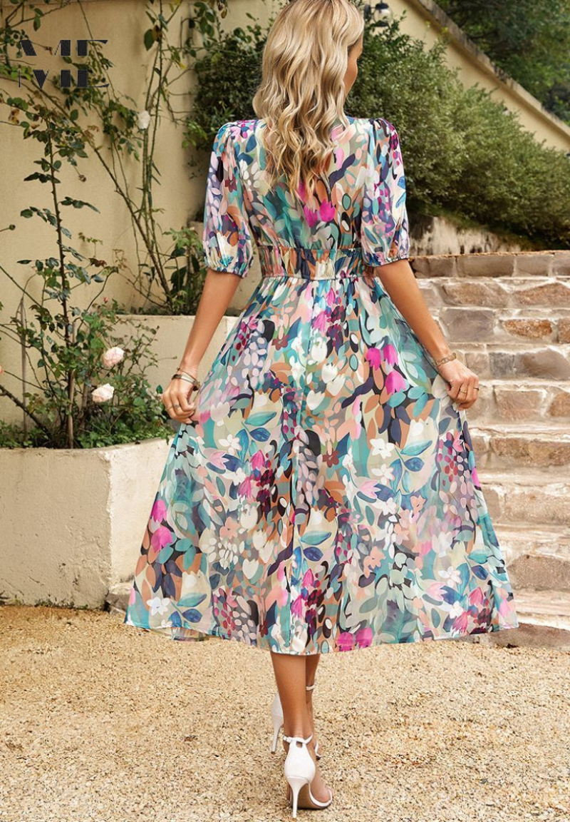 Model in floral maxi dress, standing pose showing front silhouette