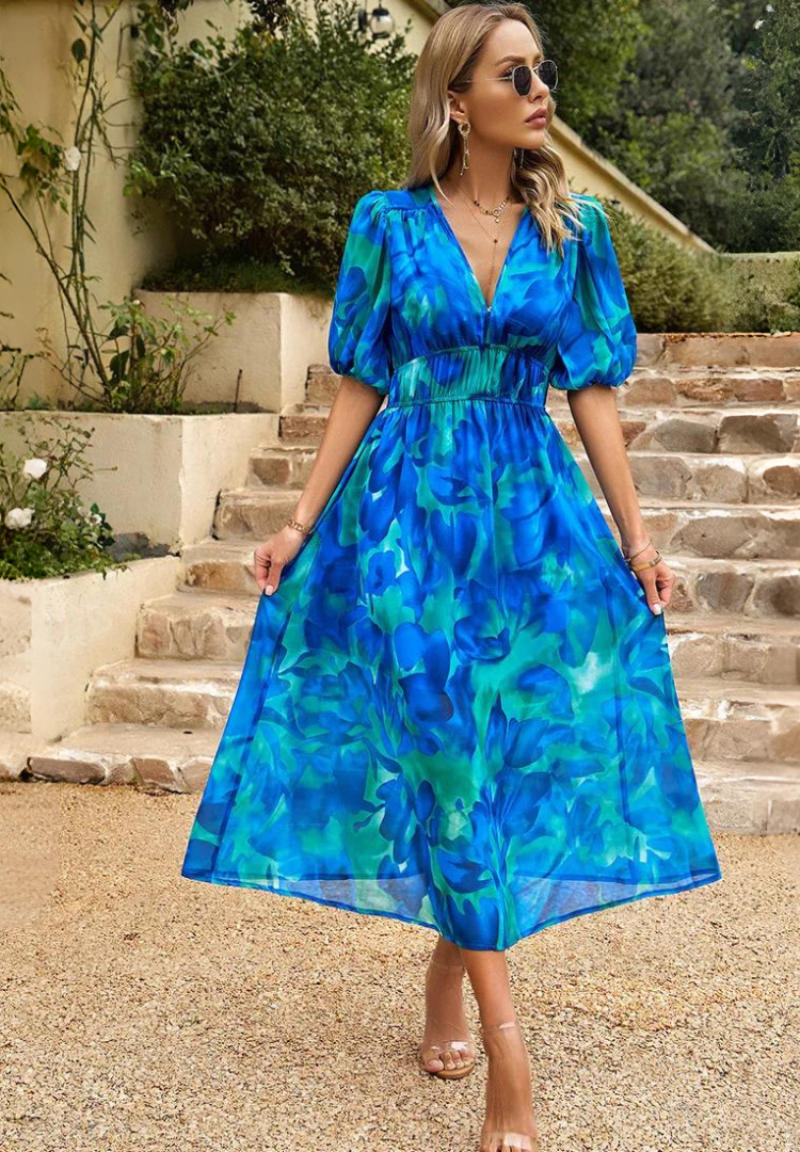 Side profile of floral dress showing maxi length and drape