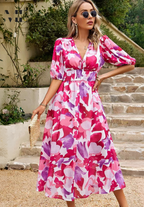 Woman wearing floral maxi dress, full-length back view