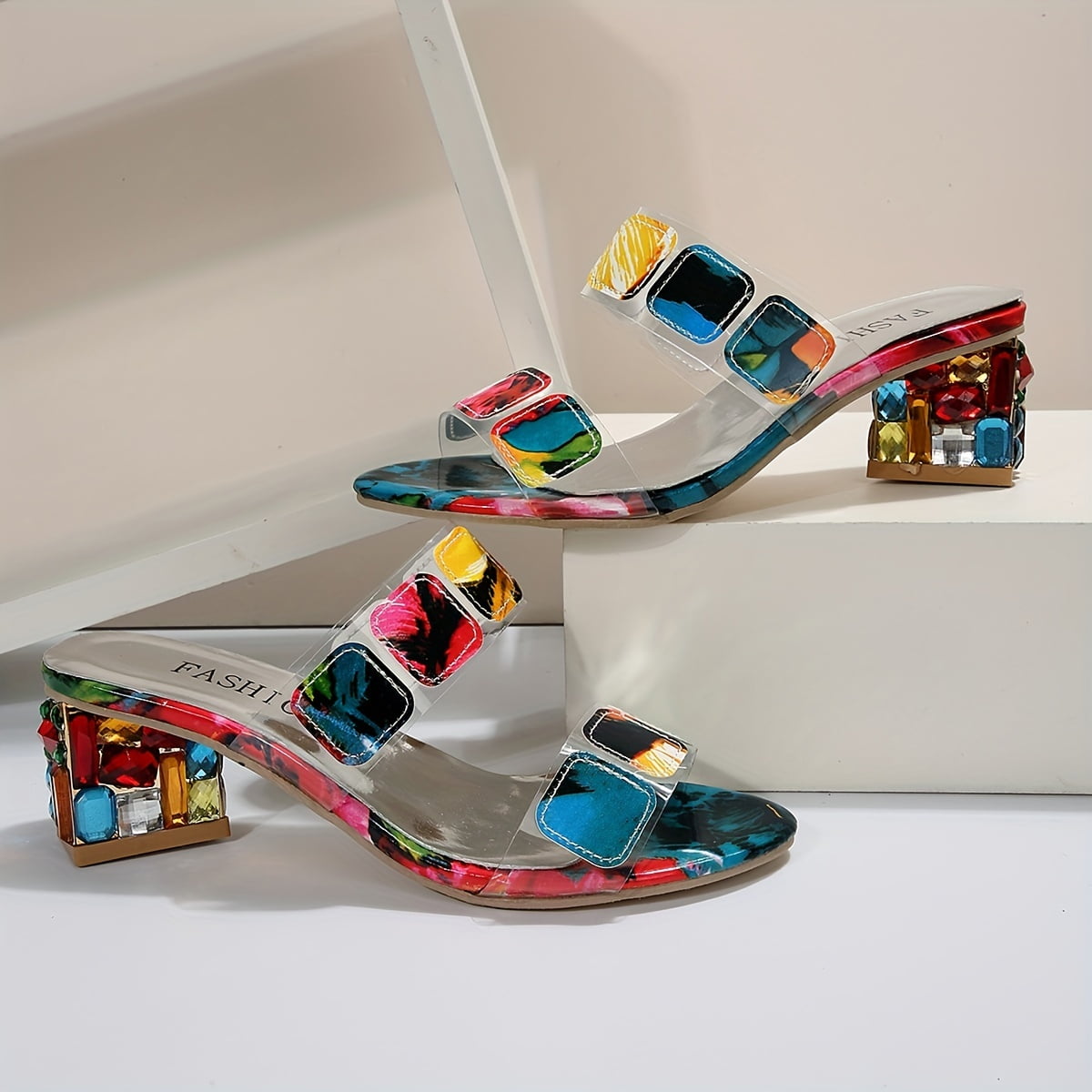 Close-up of vibrant multicoloured jewel embellishments on sandal straps