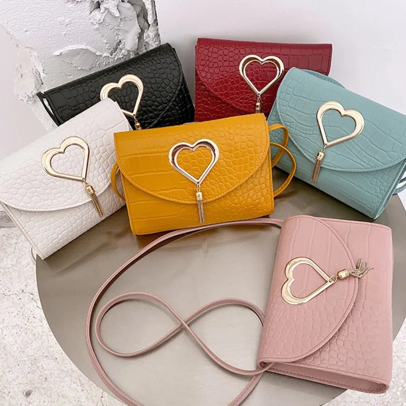 Woman wearing mustard crossbody bag across body, side angle