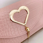 Back view of mustard croc embossed bag with adjustable strap
