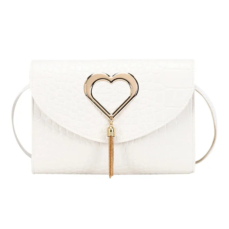 Heart clasp detail in silver tone with dangling tassel