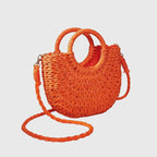 Model styling straw bag with casual summer outfit
