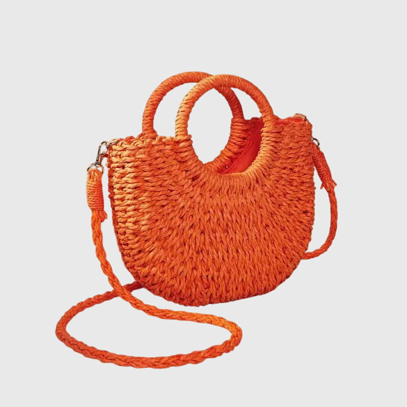 Model styling straw bag with casual summer outfit