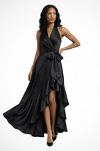 Side pose displaying halter neckline and flowing maxi silhouette