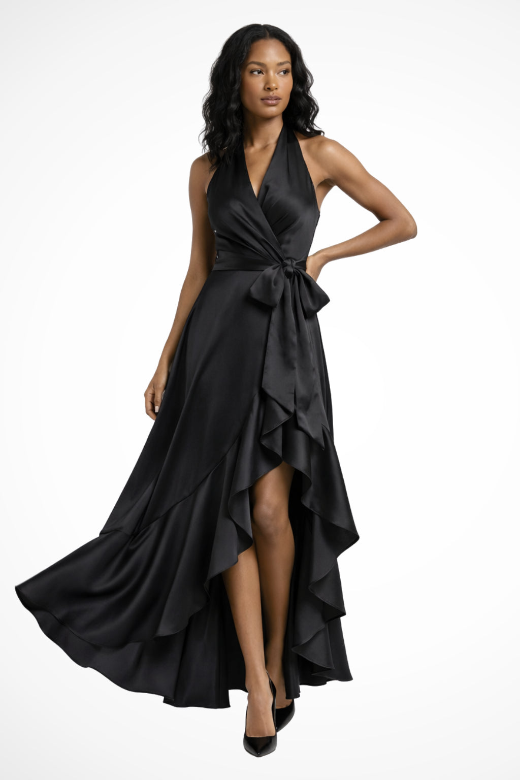 Side pose displaying halter neckline and flowing maxi silhouette