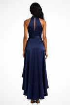 Front view of dress showing wrap bodice and asymmetric ruffled hem