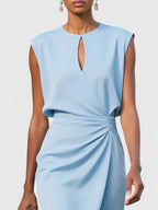 Navy sleeveless dress styled for occasion wear, three-quarter angle