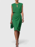 Model wearing navy midi dress, full-length side profile pose