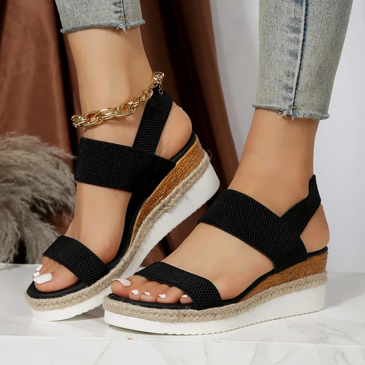 Close-up of textured navy elastic strap and platform sole detail