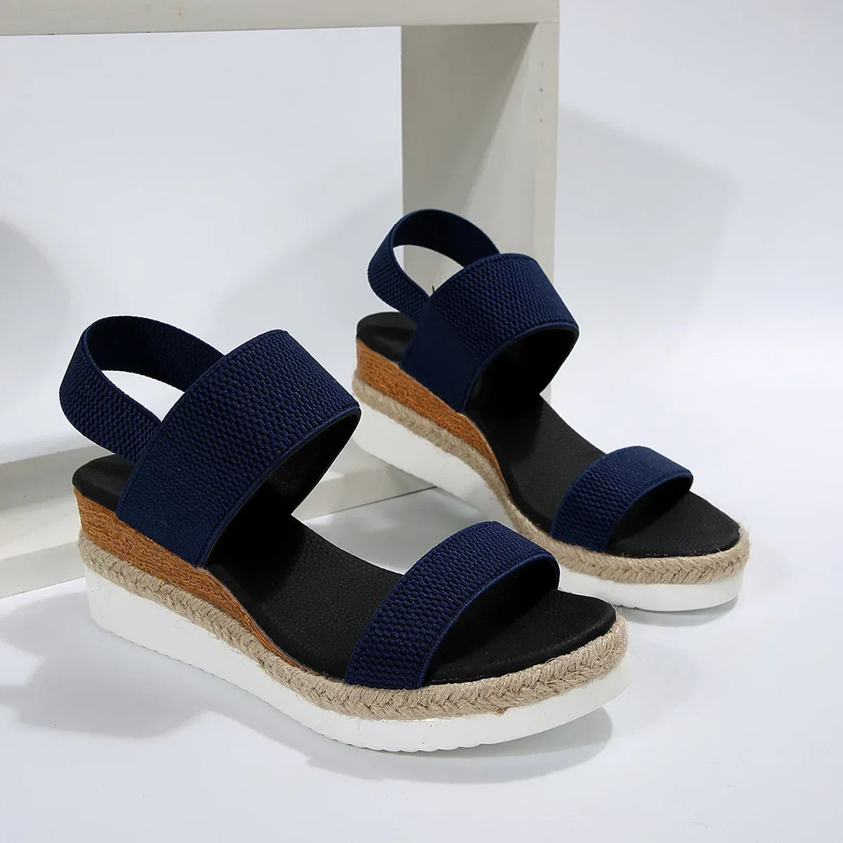 Overhead view of espadrille sandals showing jute and white base
