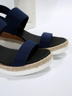 Back view of platform sandals displaying strap construction