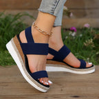 Flat lay of navy espadrille sandals showing sole and interior
