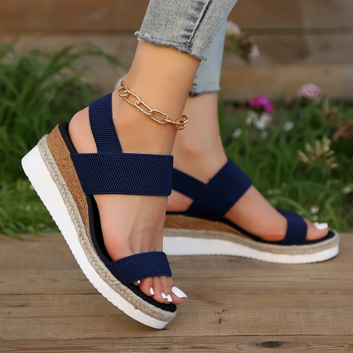 Flat lay of navy espadrille sandals showing sole and interior