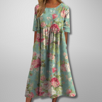 Model wearing floral midi dress, full-length standing pose