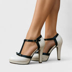 Close-up of black T-bar strap and nude platform base detail