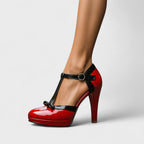 Model wearing nude and black platform heels, standing pose showing full leg