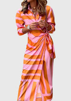 Model wearing geometric wrap dress, full-length standing pose