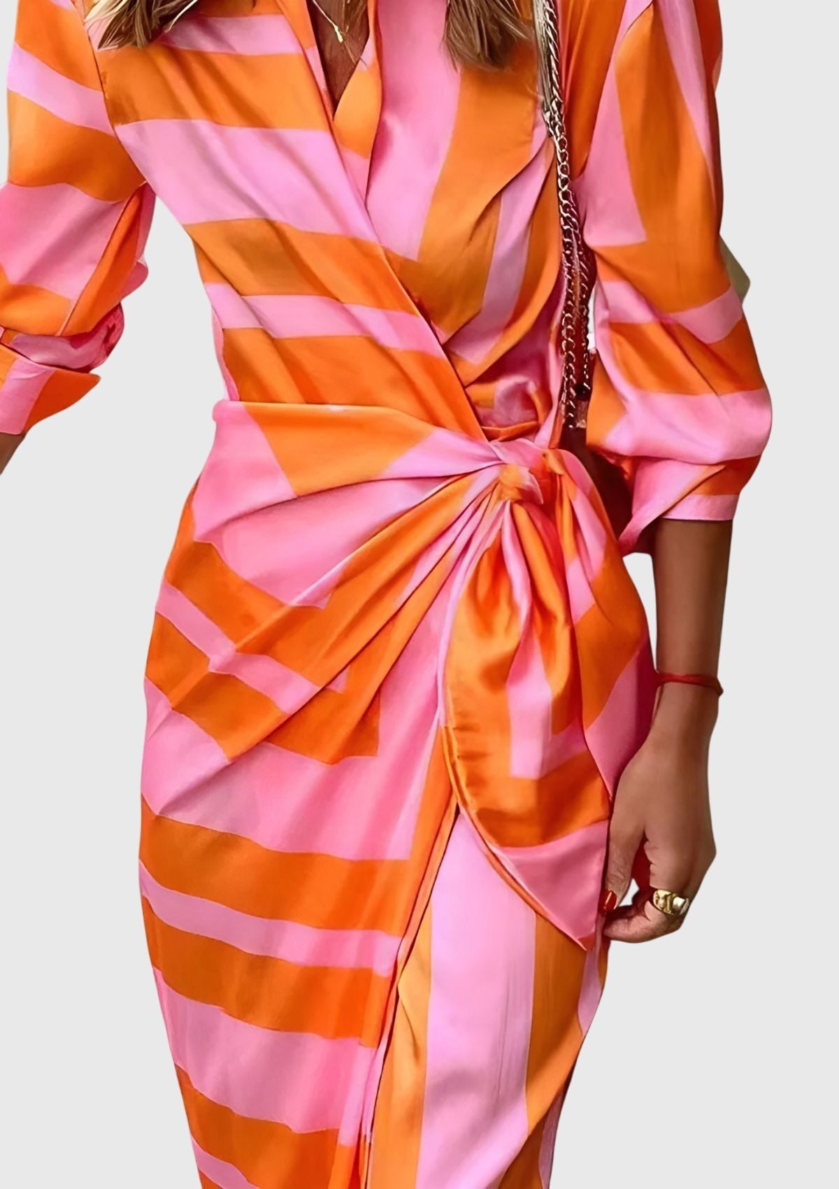 Detail of wrap neckline and collar on geometric dress