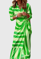 Geometric wrap dress hem and length detail, standing shot