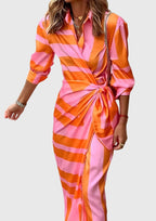 Model in geometric dress, three-quarter turn pose