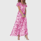 Rear view of peach floral maxi dress showing back neckline and drape