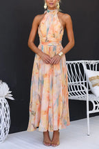 Women's peach watercolour halter neck maxi dress, full length front view