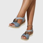 Woman walking in espadrille wedge sandals on paved surface