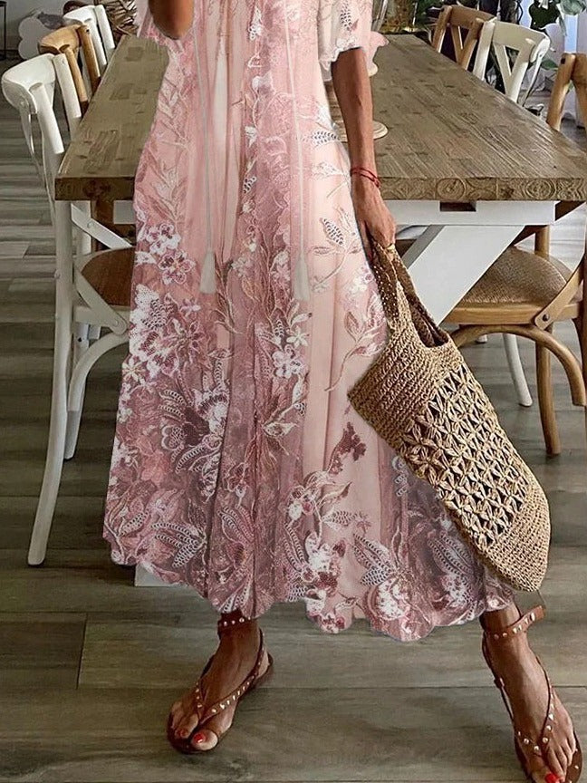 Close-up detail of delicate pink floral lace print on dress fabric