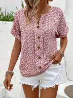 Close-up detail of scattered floral print and button fastenings