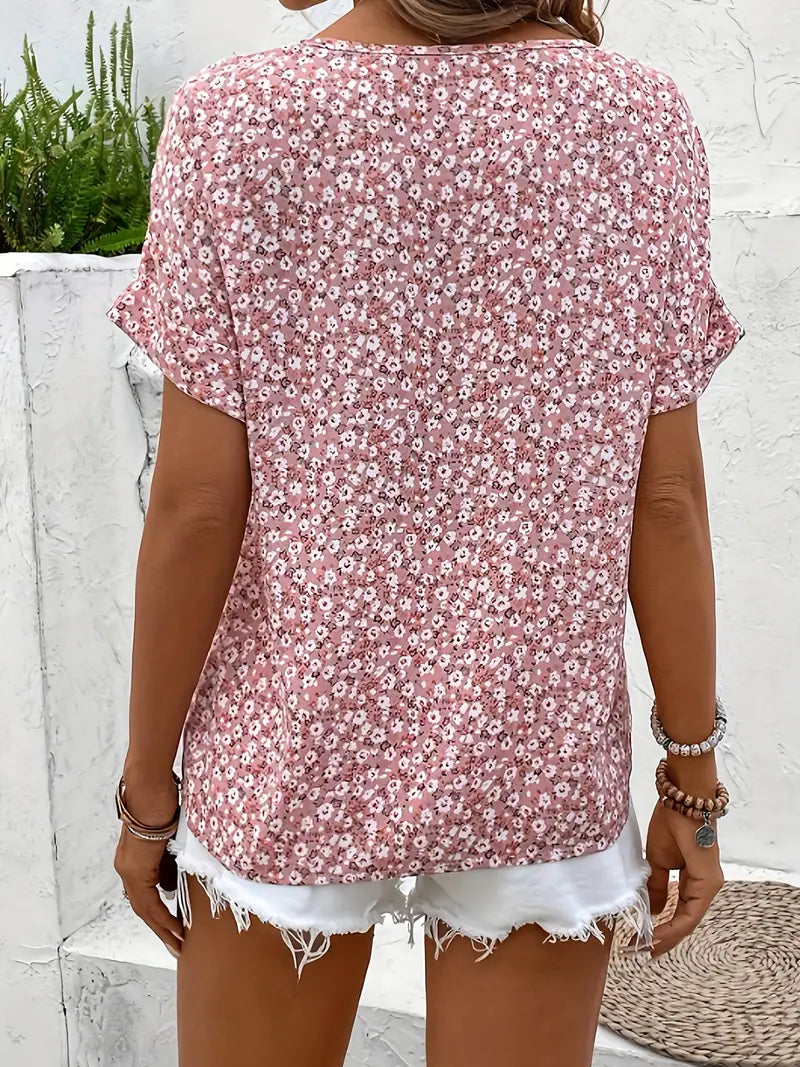Model wearing pink floral blouse, standing pose showing relaxed fit